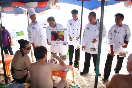 Chefs solicit donations through selling macaroons to tourists on Pattaya Beach. 