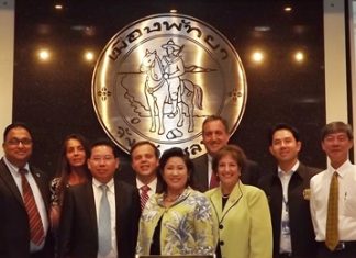 IBM executives pose at City Hall after presenting their ideas about building a public security system for tourists, improving traffic in Pattaya and increasing logistics potential at Laem Chabang Port.