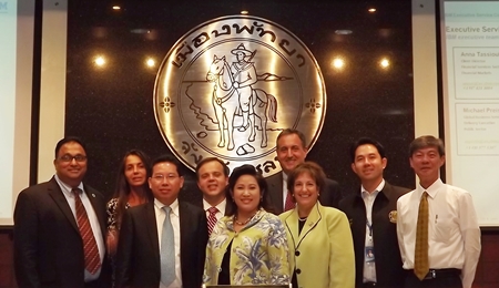 IBM executives pose at City Hall after presenting their ideas about building a public security system for tourists, improving traffic in Pattaya and increasing logistics potential at Laem Chabang Port. 
