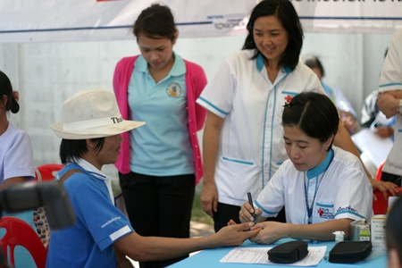 Doctors and city officials visit the Old Naklua Market neighborhood to administer medicine, provide checkups and give advice to those unable or unwilling to visit a hospital. 