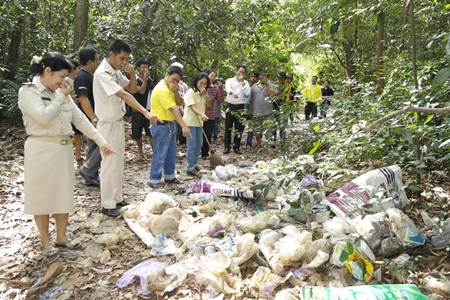Village Chief Watcharee Vichiensakulchot (left) leads residents and workers to clean up after the typically irresponsible behavior of leaving garbage in their national park. 