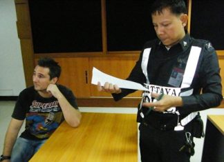 Arthur Wilhelm Grudda (seated) has been arrested and charged with falsifying government documents and fraud.