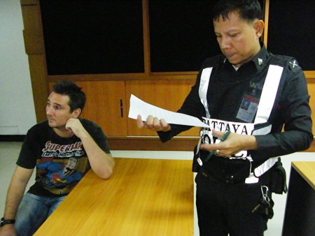 Arthur Wilhelm Grudda (seated) has been arrested and charged with falsifying government documents and fraud. 