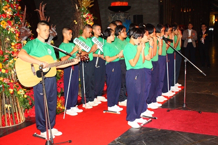 Students from the Pattaya Redemptorist School for the Blind play Christmas music during the lighting of the Christmas tree at Centara Grand Mirage Beach Resort Pattaya. 