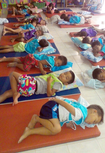 The kids from Hand to Hand enjoy their new mattresses apart of their wish list from the family fun day. 