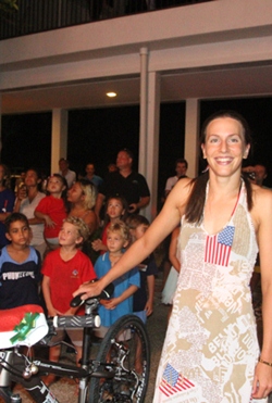 Triathlon Olympian Radka Vodickova span the pedal-powered generator to light up the tree.  