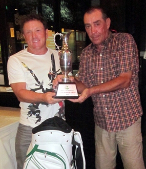 Paul Smith (left) is presented with the Low Gross trophy my Glyn Evans.