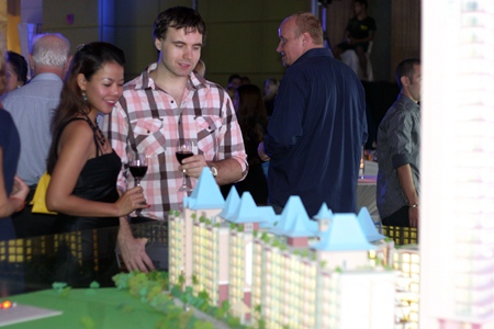 Guests view a scale model of the Grande Caribbean Condo Resort. 