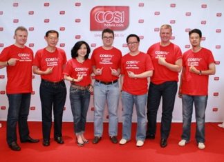 Staff and management of Centara Hotels & Resorts including Chief Executive Officer Thirayuth Chirathivat (center) and Vice President of Business Development, Suparat Uahwatanasakul (3rd right), pose for a photo in Bangkok during the official launch of the COSI Hotels brand.