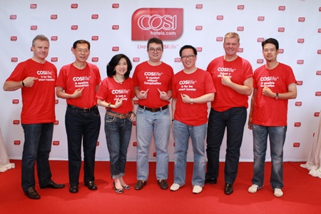 Staff and management of Centara Hotels & Resorts including Chief Executive Officer Thirayuth Chirathivat (center) and Vice President of Business Development, Suparat Uahwatanasakul (3rd right), pose for a photo in Bangkok during the official launch of the COSI Hotels brand.