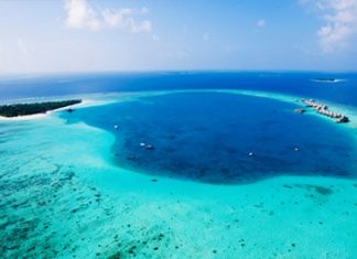 A bird’s eye view shows the South Nilandhe Atoll and the Angsana Velavaru resort.