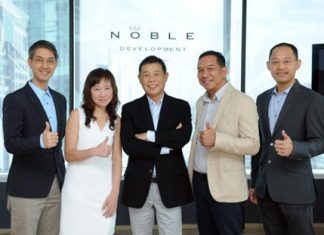 Kitti Thanakitamnuay, Chairman and CEO of Noble Development PLC (center) poses with other Noble directors at the announcement of the company’s plans for 2013.