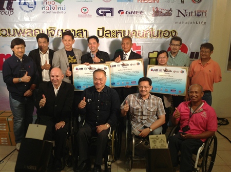 The Redemptorist Vocational School for People with Disabilities was deservedly presented with an outstanding service award in appreciation of their dedication and service to the community, more especially for promoting human rights and equality for all human beings. Amongst the guests at the presentation were (standing) Transport Minister Chatchart Sittipan (2nd left), Mayor Itthiphol Kunplome (4th left), Nong Nooch Tropical Garden owner Kampol Tansaccha (4th right), Father Dr Picharn Jaiseri and Somrit Chapiro. Front row: Jens Maspfuhl (left), RVSPD Principal Suporntham Mongkolsawat (2nd right) and Manop Eiemsa-art (right).
