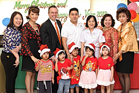 To celebrate the festive season Yutthachai Charanachitta (centre), president & CEO of Amari Estates Co., Ltd., together with Pierre Andre Pelletier (3rd left), general manager of Amari Watergate Bangkok, hosted a lunch and presented gifts to orphans living at the Thai Red Cross Children’s Home during the Christmas and New Year holidays. They were joined by hotel management at the festivities. (L to R) Wanna Charoenchaimongko, director of finance; Nichaya Chaivisuth, director of communications & PR; Amporn Jeamjaturapatporn, chief of child care services at the Thai Red Cross Children’s Home; Chatrapee Kantariyo; executive assistant manager and Laddawan Chansawang, manager of accounting.