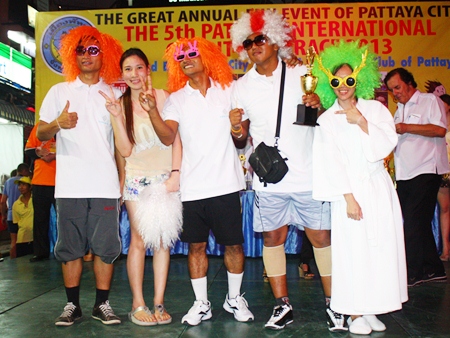 The Cape Dara Hotel team poses with their souvenir cup for the Pattaya International Bed Race.