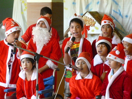 Camillian kids with disabilities singing Christmas carols at the Camillian Home.