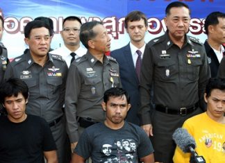 Sitting from left, Anuwat Wat-Onn, 32, Wichen Jaija, 35, and Thongchai Jandee, 20, have been arrested on rape and robbery charges. (AP Photo/Apichart Weerawong)