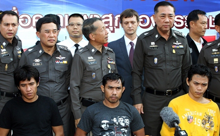 Sitting from left, Anuwat Wat-Onn, 32, Wichen Jaija, 35, and Thongchai Jandee, 20, have been arrested on rape and robbery charges. (AP Photo/Apichart Weerawong) 