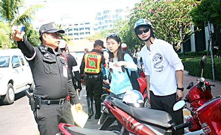 Go pay your fine at the police station over there on Soi 9.