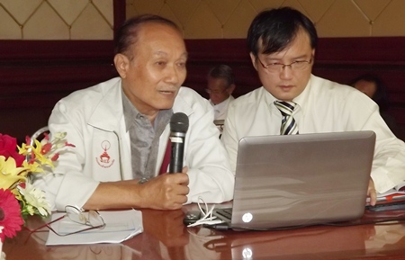 Asst. Prof. Narong Kularb (left), traffic engineer / consultant for the Pattaya underpass project, and K. Jirawat, civic engineer from Punya Technology Co. Ltd. (right), listen to opinions about the proposed Sukhumvit underpasses. 