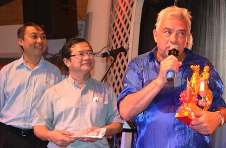 Johnny presented a donation to Father Peter and Father Michael of the Father Ray Foundation.