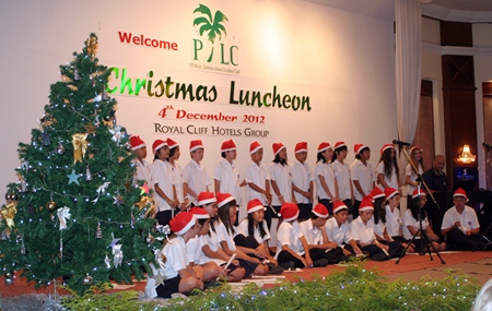 Children from the Regents School sing Christmas carols.