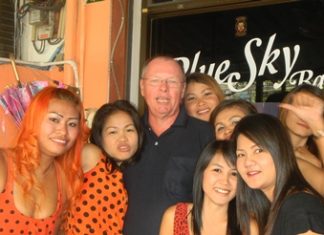 Dan celebrates with the staff at Blue Sky Bar.