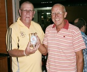 John Davis (right) is presented with the Growling Swan Monthly Mug by host Peter Grey.