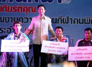 Ittipol Kunplome, Mayor of Pattaya City (center) presents awards to disabled athletes Watcharapol Wongsa, Sukhum Namlum and Sukachai Koizup.