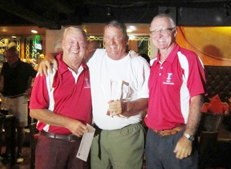 Seniors Champion Don Lehmer (center) receives his award.