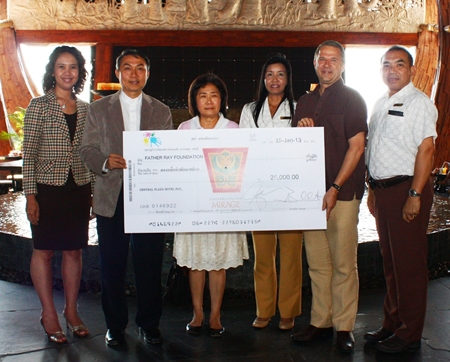 Andre Brulhart (2nd right), GM of Centara Grand Mirage Beach Resort Pattaya presents a donation of 25,000 baht to Rev. Peter Pattarapong Srivorakul (2nd left), President of the Father Ray Foundation in Pattaya and Ajima Chavalit-Thamrong (3rd left), Fundraising Manager. The funds were raised during the hotel’s 3rd anniversary celebrations and annual Christmas Tree Lighting Ceremony in 2012. Other staff members at the presentation included Usa Pookpant, Public Relations Manager; Sukanya Wongdornma, Financial Controller and Wuthisak Pichayagan, Executive Assistant Manager F&B.