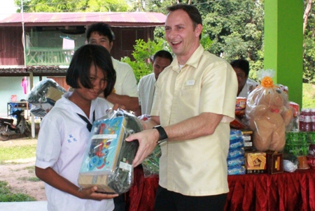 “Bright eyes and thankful smiles dominate when people from Thai Garden Resort visit Baan Tungklom School.”
