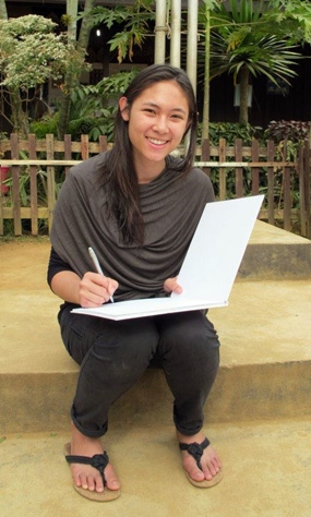 Phantila signs copies of her book.