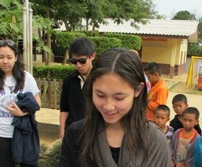 Phantila Phataraprasit donates copies of her book “The Story of Baitong & Boon” to children in Kiew Karn Village.