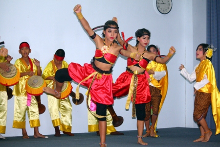 Girls from Pattaya School No. 7 give a traditional Thai boxing dance demonstration to the beat of boys playing the long drums.