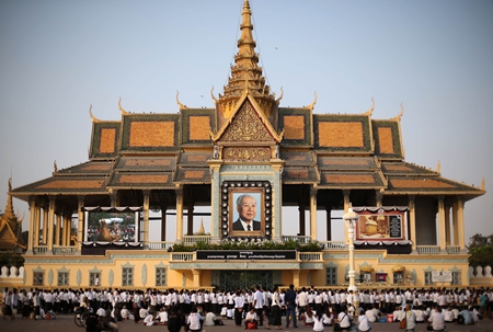 Thousands of mourners gather at the Royal Palace and wait in line to pay their respects in Phnom Penh, Saturday, Feb. 2. (AP Photo/Wong Maye-E)