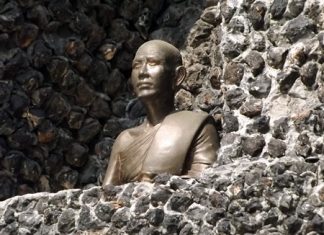 A statue of Provost Viboon Sangkhakan, who served from 1937 until his death in 1982, sits inside the monument.