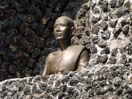 A statue of Provost Viboon Sangkhakan, who served from 1937 until his death in 1982, sits inside the monument.