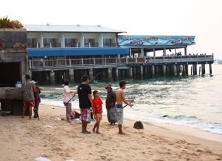 The entire family turns out for a day of fishing at the site where the old Pattaya pier once stood.