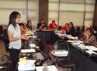 Phusa Sriwilas (left), from the Asia and Pacific office of ECPAT International, addresses a meeting of caring citizens concerned with protecting our children.