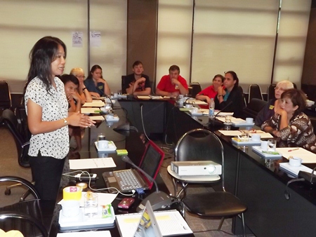Phusa Sriwilas (left), from the Asia and Pacific office of ECPAT International, addresses a meeting of caring citizens concerned with protecting our children.