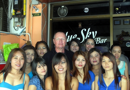 Dan ‘The Diet Whiskey Man’ (rear-center) celebrates his win with the staff at Blue Sky Bar.