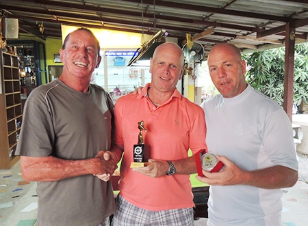 Paul Greenway (center) presents the Monthly Medal trophy to Paul Bourke (left) with low gross winner, Ian Heddle (right).