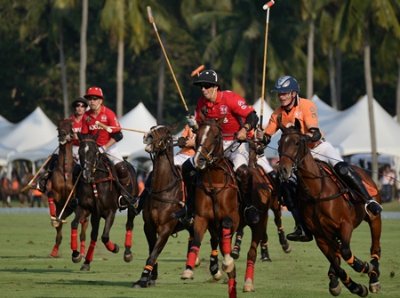 Thai Polo and AXUS fight for possession of the ball during the first half of the match.