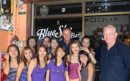 Randy & Don celebrate their golfing success with the staff at Blue Sky Bar.