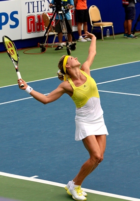 The graceful Kirilenko serves to Lisicki during the opening set.
