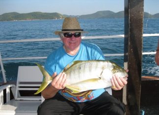 A happy angler with a 5kg trevally catch.