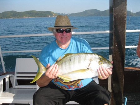 A happy angler with a 5kg trevally catch.