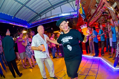 Eva Johnson (right) balances beer with some smart moves on the dance floor.