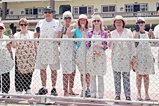 While cruising the waters of South East Asia, the luxury liner Crystal Symphony sailed into Thai waters and docked at nearby Laem Chabang recently. Many guests rushed off to see the sights of Bangkok or spend their money in the shops of Pattaya. One group arrived in Pattaya and spent their time volunteering at the Redemptorist Vocational School for People with Disabilities. As well as learning about the school and meeting the students, the visitors also spent several hours painting the surrounding fence on the sports court, and they did a wonderful job.